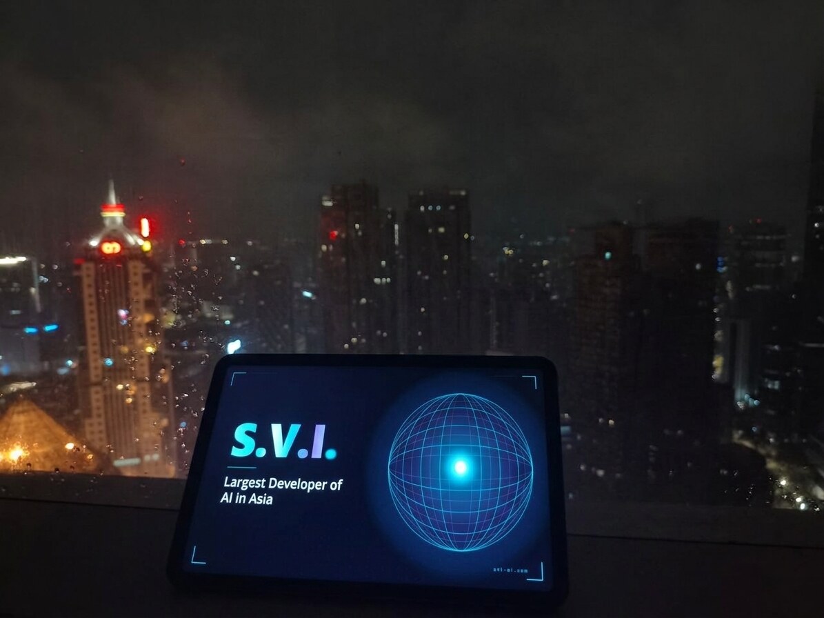 S.V.I. above the night cityscape — from a skyscraper rooftop